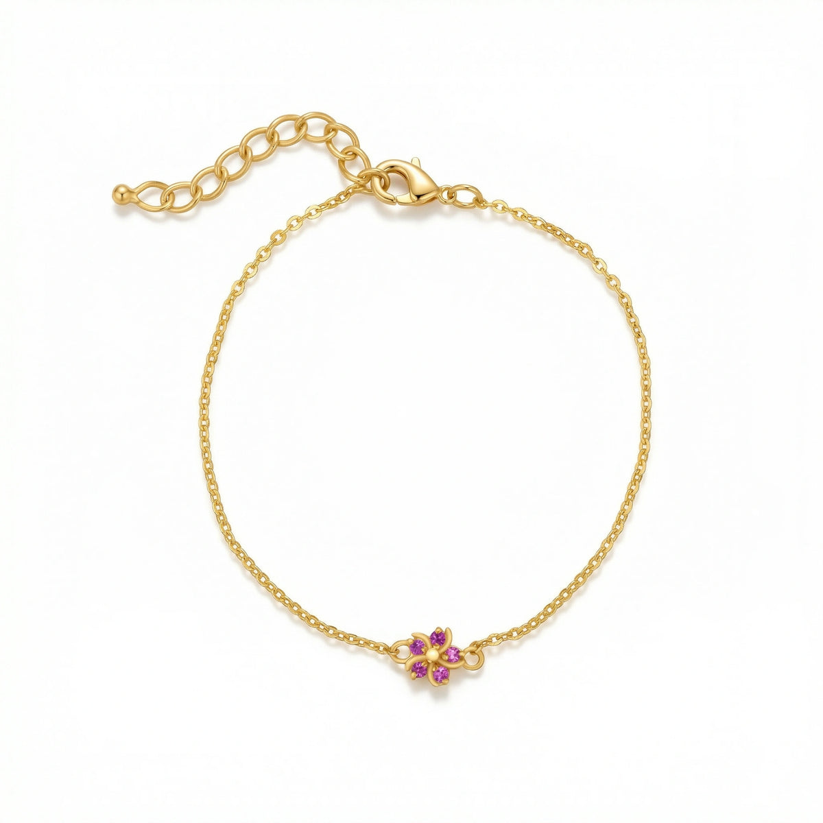 18k gold plated bracelet with a small floral clasp featuring pink and purple stones on a white background