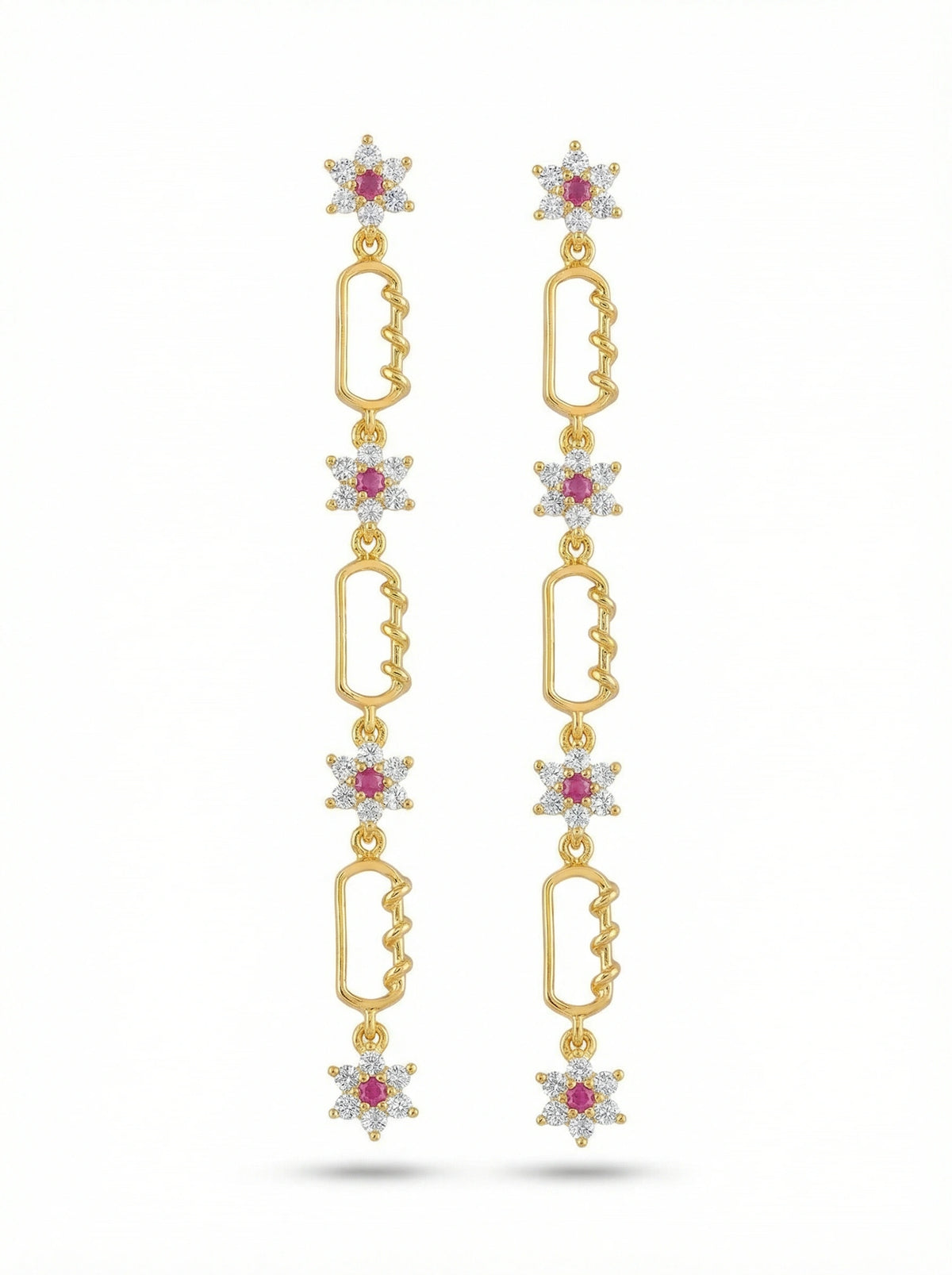 18k Gold plated earrings with star-shaped elements and red gemstones on a white background