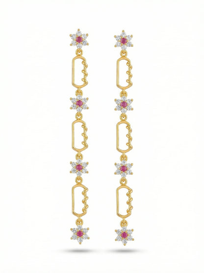18k Gold plated earrings with star-shaped elements and red gemstones on a white background