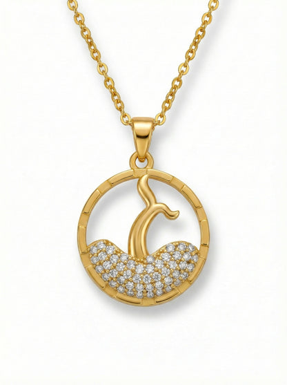 18k Gold plated necklace with a circular pendant featuring a design of a woman and child, set against a white background.