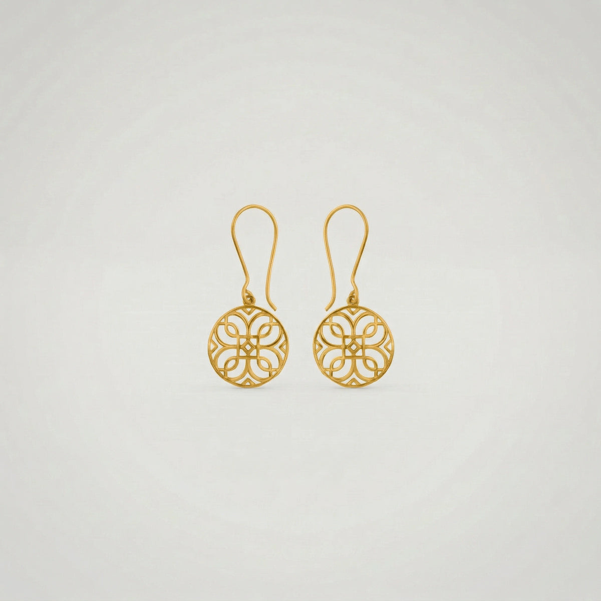 pair of 18k gold plated earrings on a light gray background