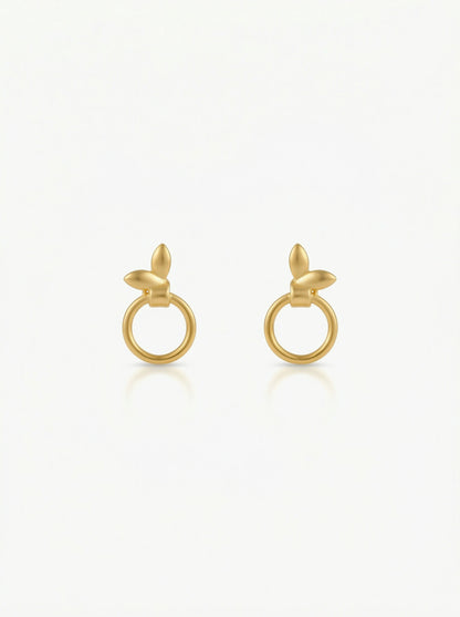 Pair of 18k gold plated earrings on a white background