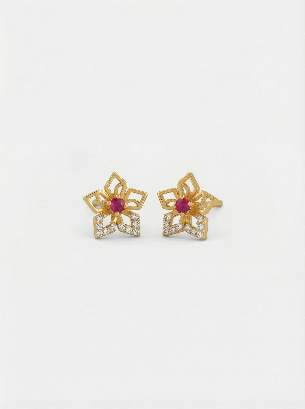 18k gold plated flower-shaped earrings with red gemstones on a white background