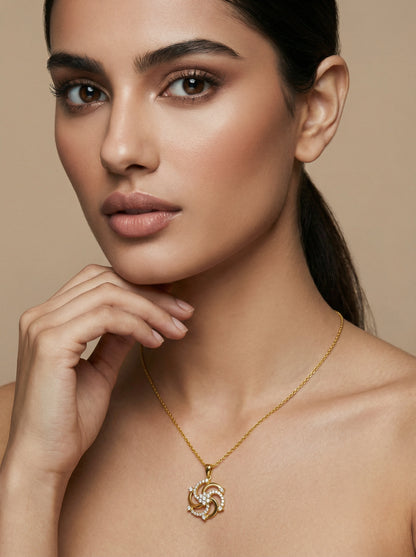 Woman wearing a 18k gold plated necklace with a heart pendant against a beige background