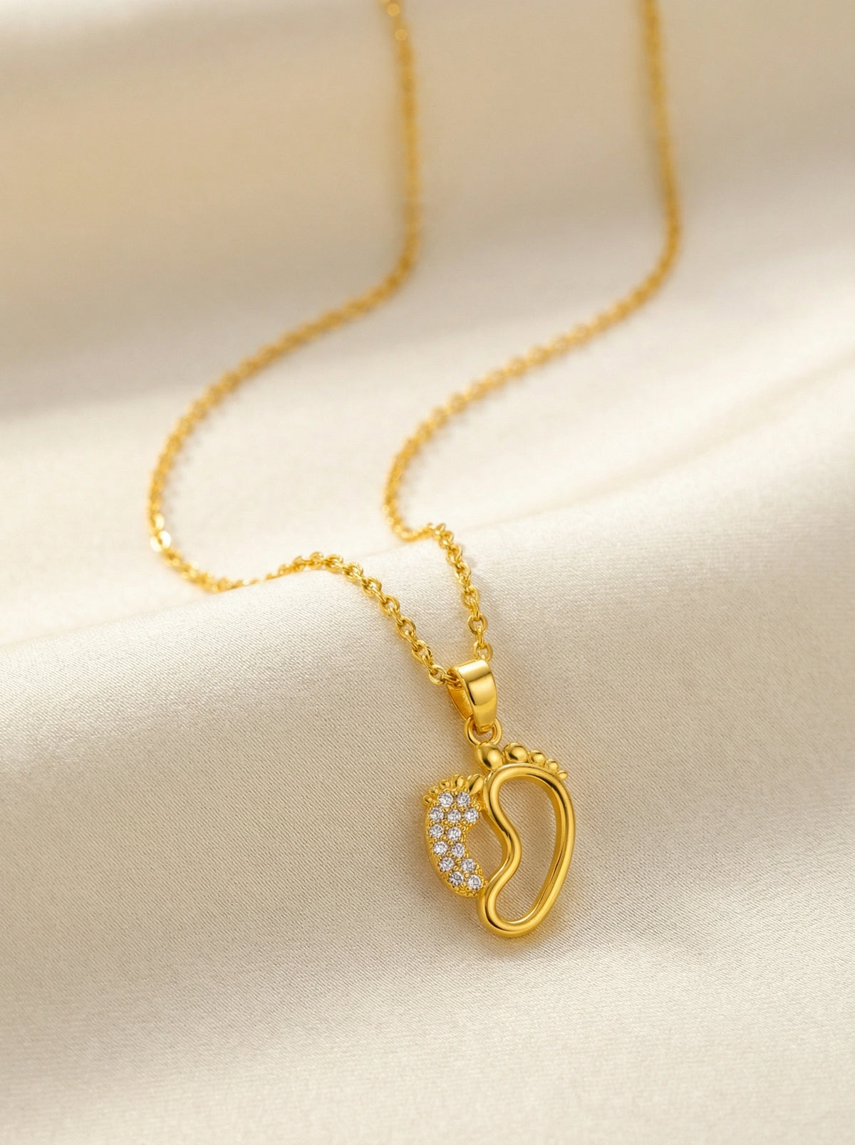 18k Gold plated necklace with a heart-shaped pendant on a beige background