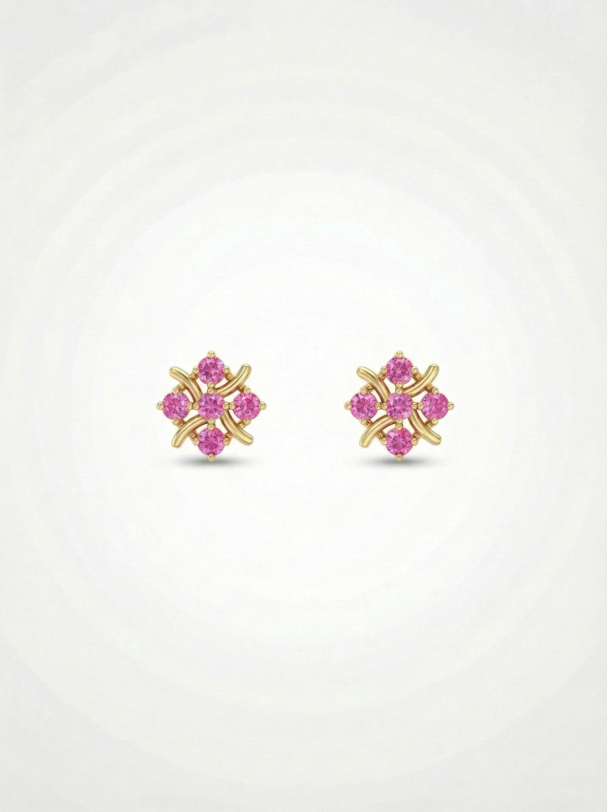 pair of 18k gold plated earrings with pink gemstones on a white  background