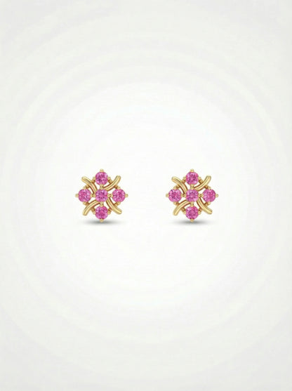 Pair of 18k gold plated earrings with pink gemstones on a white  background