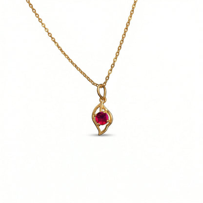 18k Gold plated  necklace with a red gemstone pendant on a white background