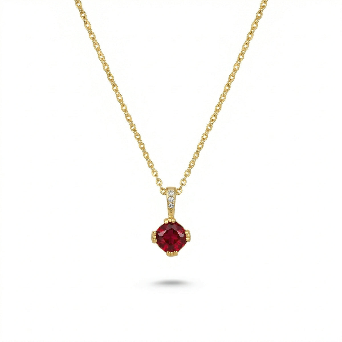 18k gold plated necklace with a red gemstone pendant on a white background
