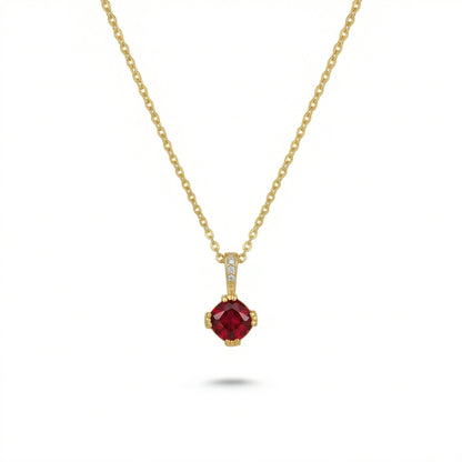 18k Gold plated necklace with a red gemstone pendant on a white background
