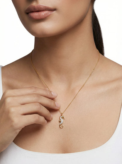 18k Gold plated necklace with a seahorse pendant worn by a person