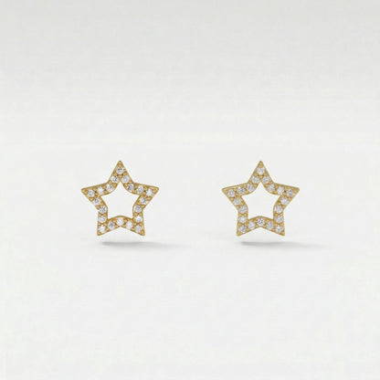 Star-shaped 18k gold plated earrings with diamond accents on a light gray background
