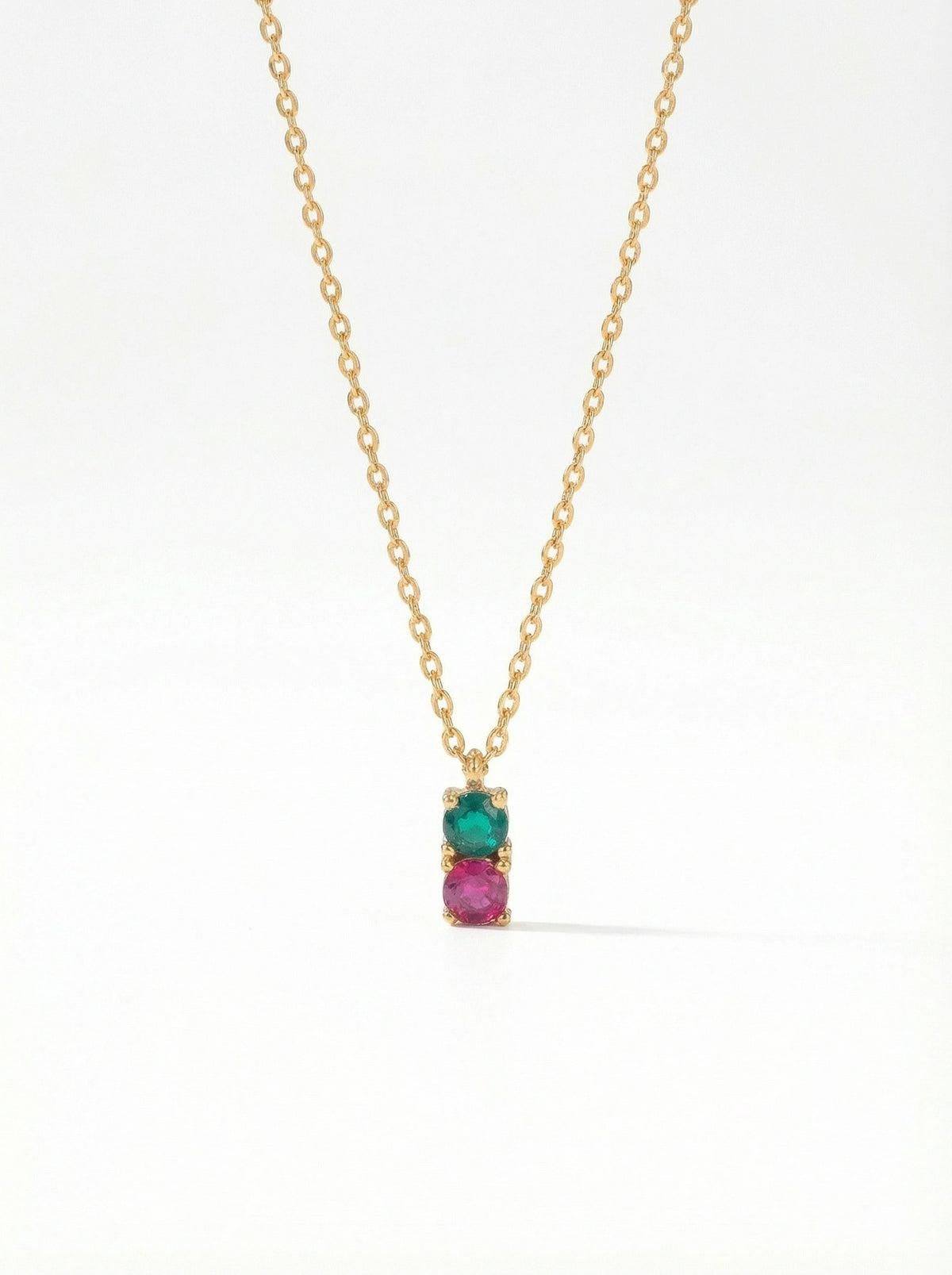 18k gold plated necklace with a pendant featuring a green gemstone and pink stone on a white background