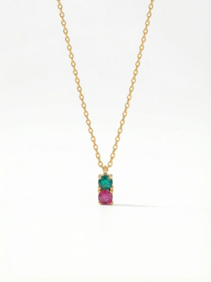 18K Gold PLATED necklace with a pendant featuring a green gemstone and pink stone on a white background