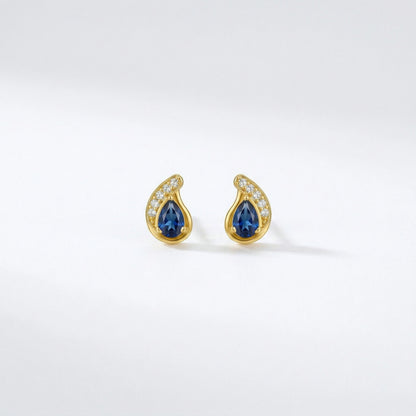 18k Gold plated earrings with blue gemstones on a white background