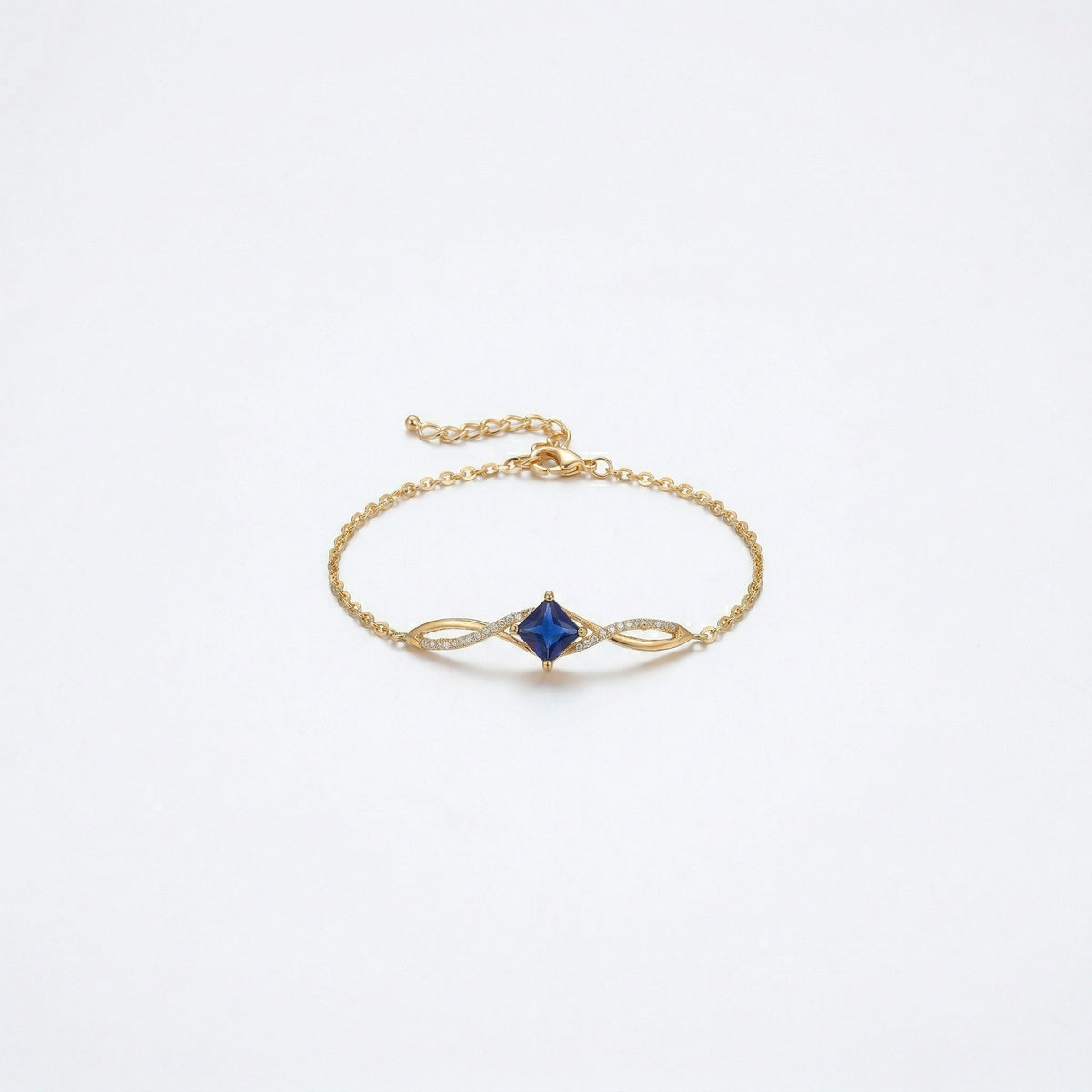 18k gold plated  bracelet with a blue gemstone on a white background
