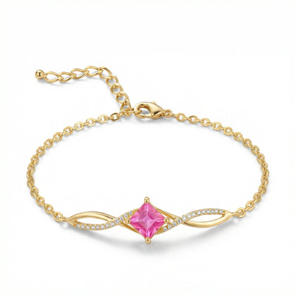 18k Gold plated bracelet with a pink gemstone on a white background