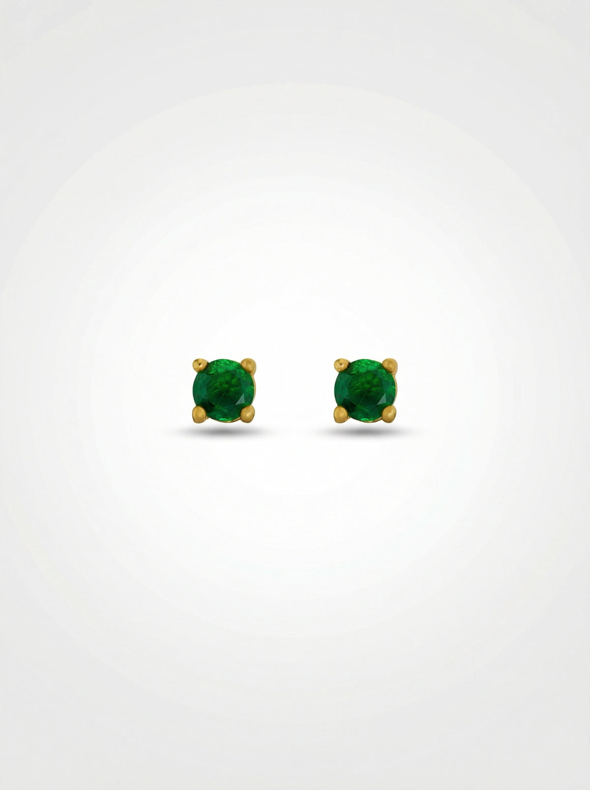 Pair of green gemstone earrings with 18k gold plated settings on a white background