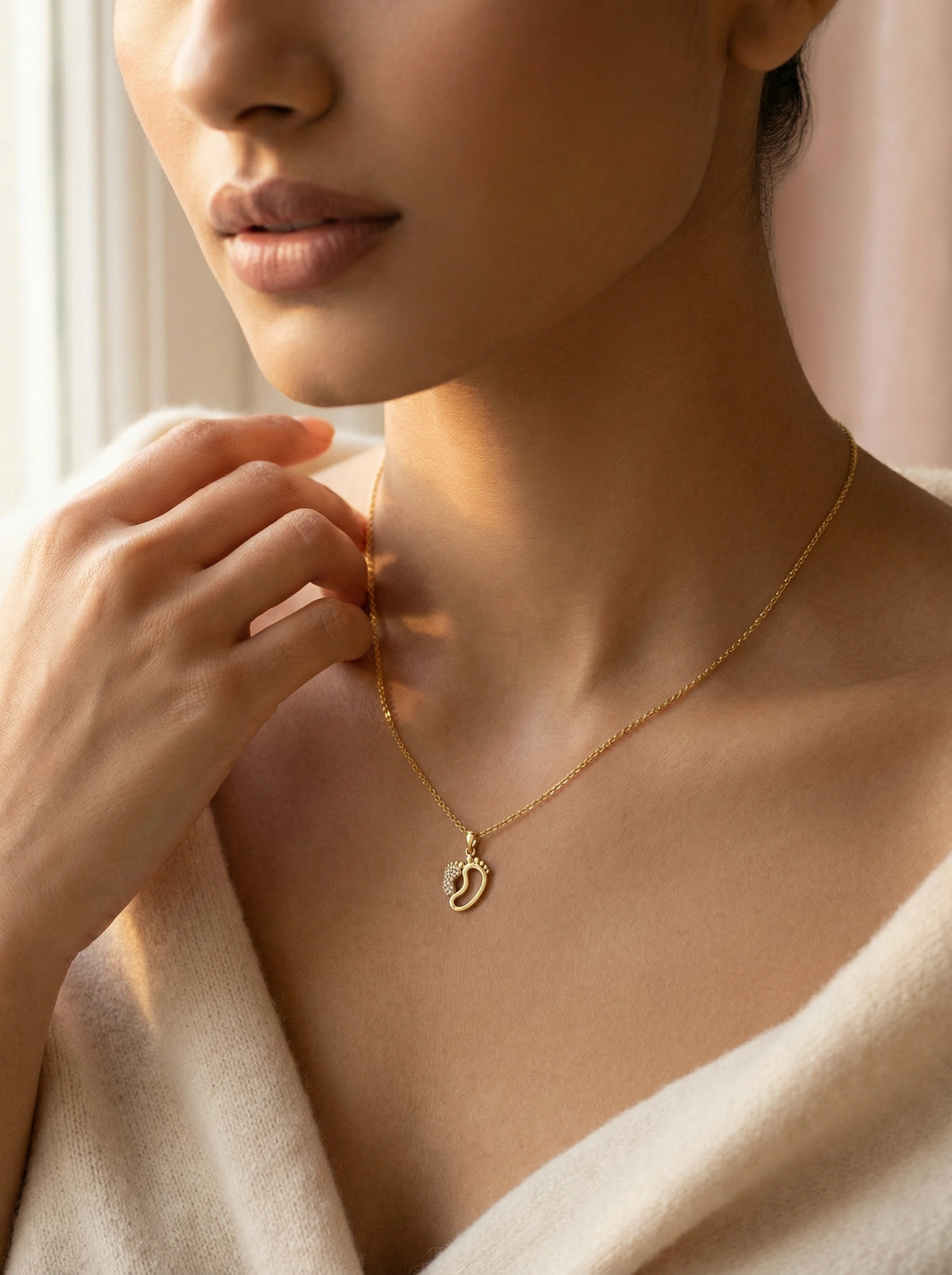 close-up of a person wearing a 18k gold plated  necklace with a heart pendant, soft focus on face.
