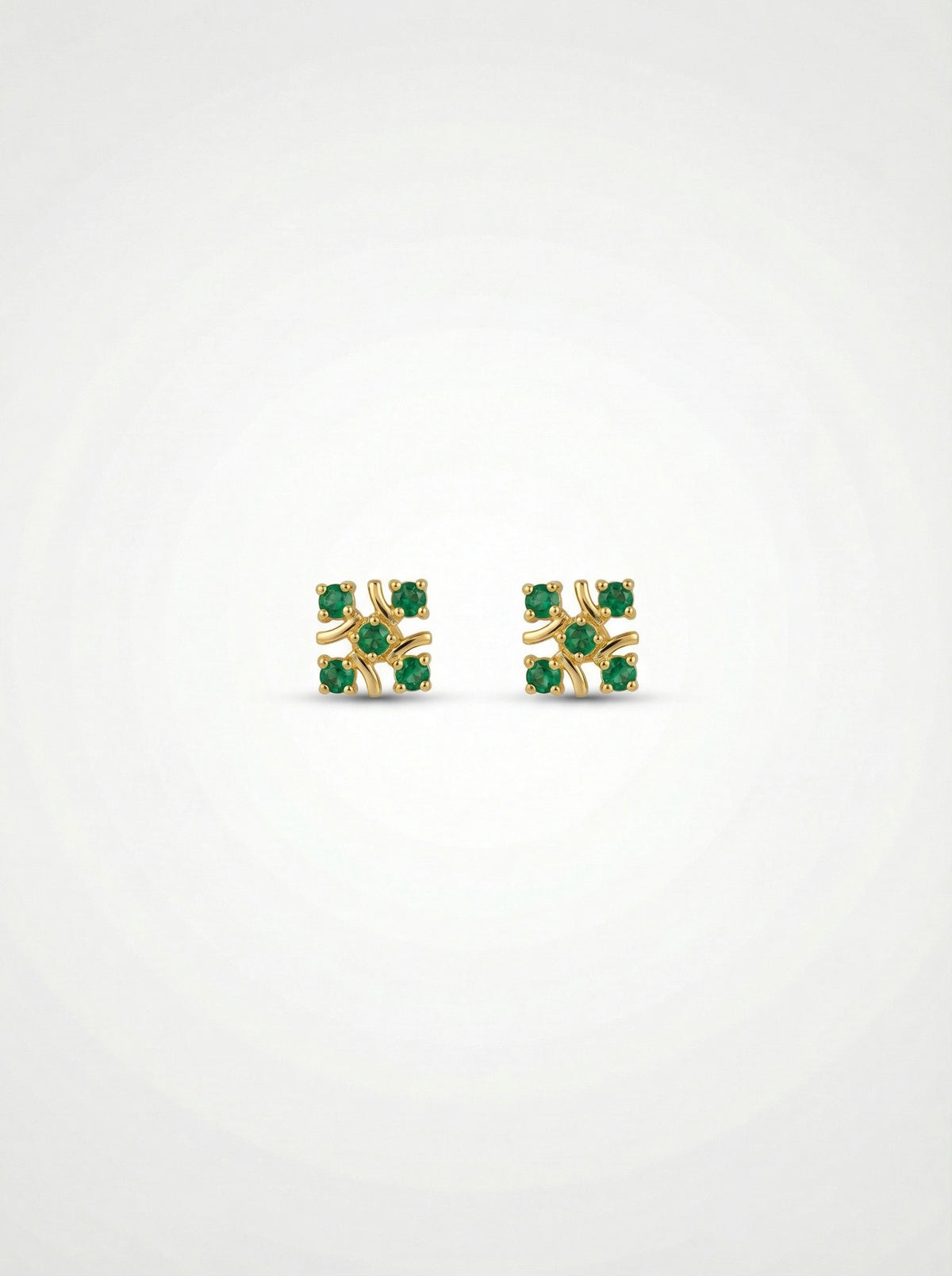 18k gold plated earrings with green gemstones on a white background