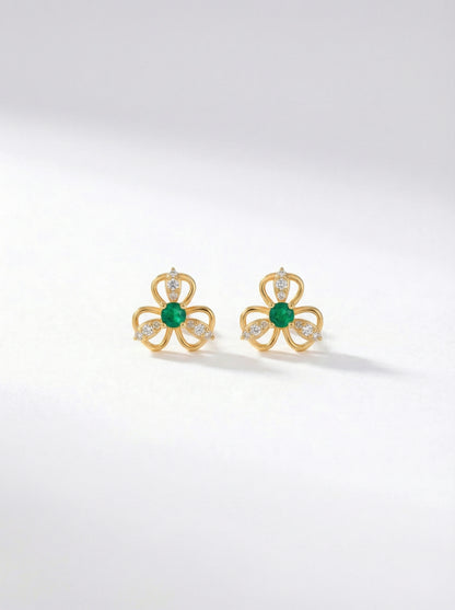 18k Gold plated earrings with green gemstones on a white background