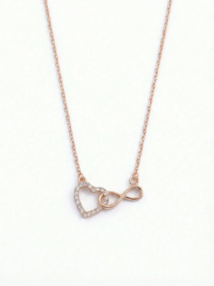  18k rose gold plated necklace with heart and infinity symbol pendant on a white background