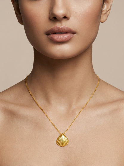 18k Gold plated necklace with a shell pendant on a neutral background