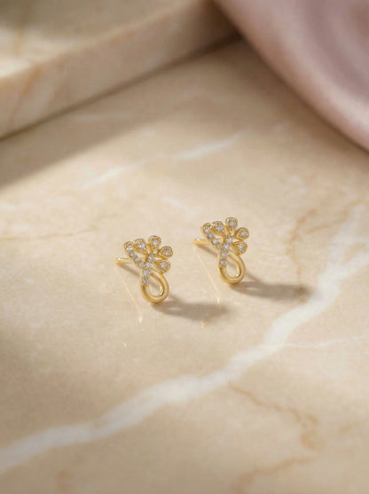 18k Gold plated earrings on a marble surface