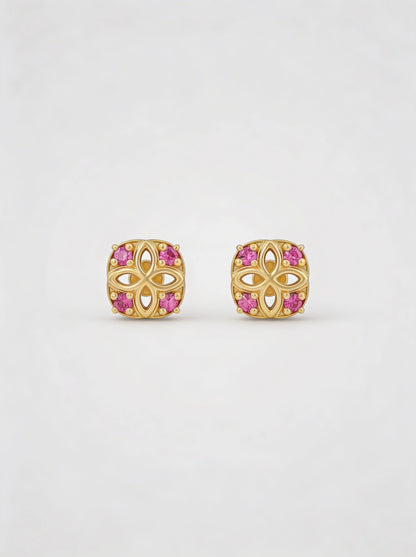 18k Gold plated earrings with pink gemstones on a white background