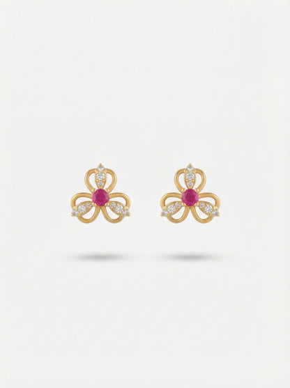 18k Gold plated bow-shaped earrings with red gemstones on a white background