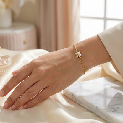 18k Gold plated bracelet on a hand with a soft, blurred background