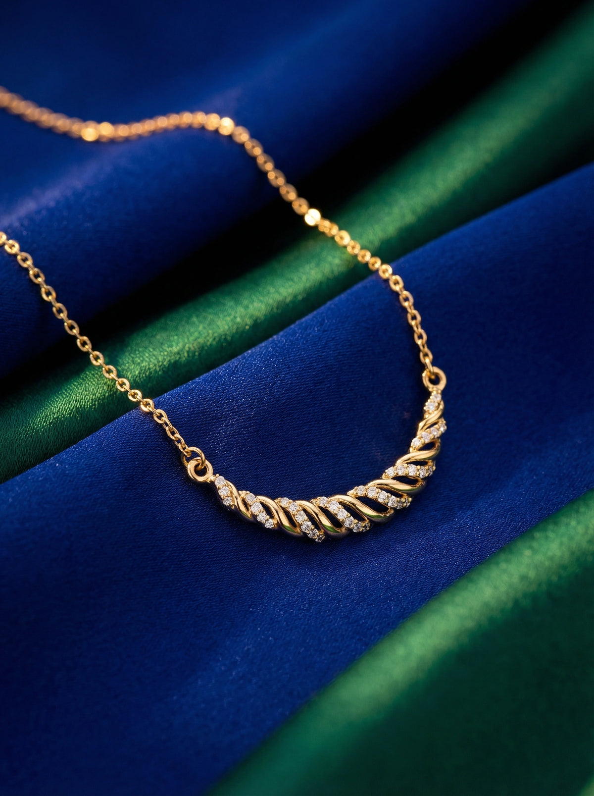 18k gold plated necklace with a twisted design on a blue and green gradient background