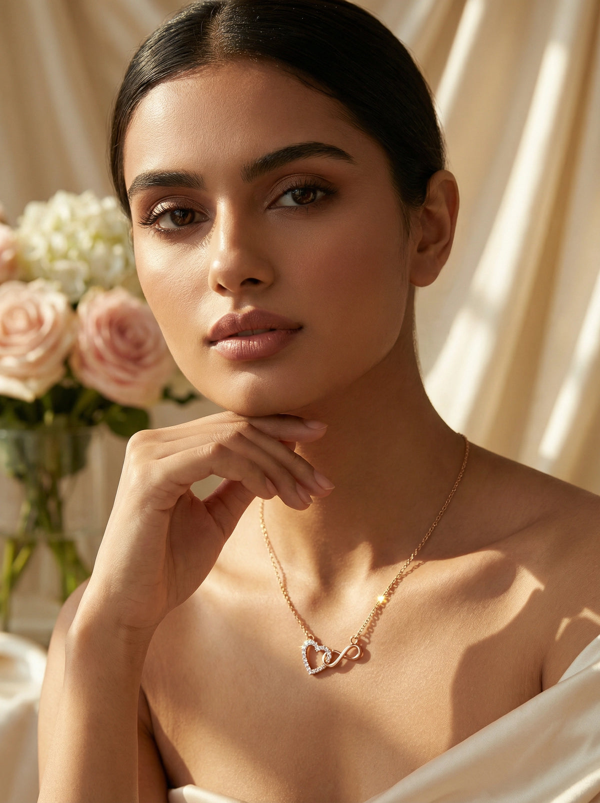 woman wearing a  18k rose gold plated  necklace with heart pendants, surrounded by flowers and soft lighting.