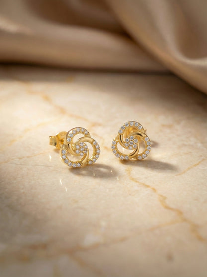 18k Gold plated earrings with diamond accents on a marble surface