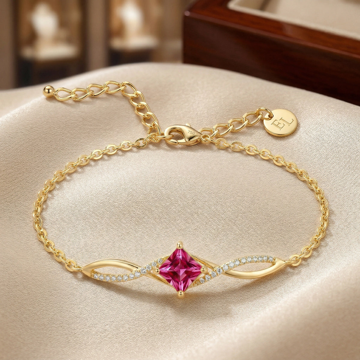 18kgold plated  bracelet with a pink gemstone on a beige surface