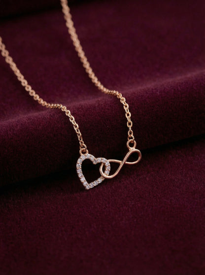 18k gold plated Necklace with heart and infinity symbol pendant on a purple fabric background