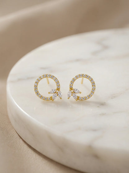 18k Gold plated  earrings with small diamonds on a marble surface