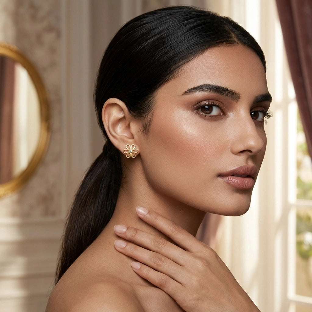 woman wearing a delicate 18k gold plated  earring in an elegant interior setting