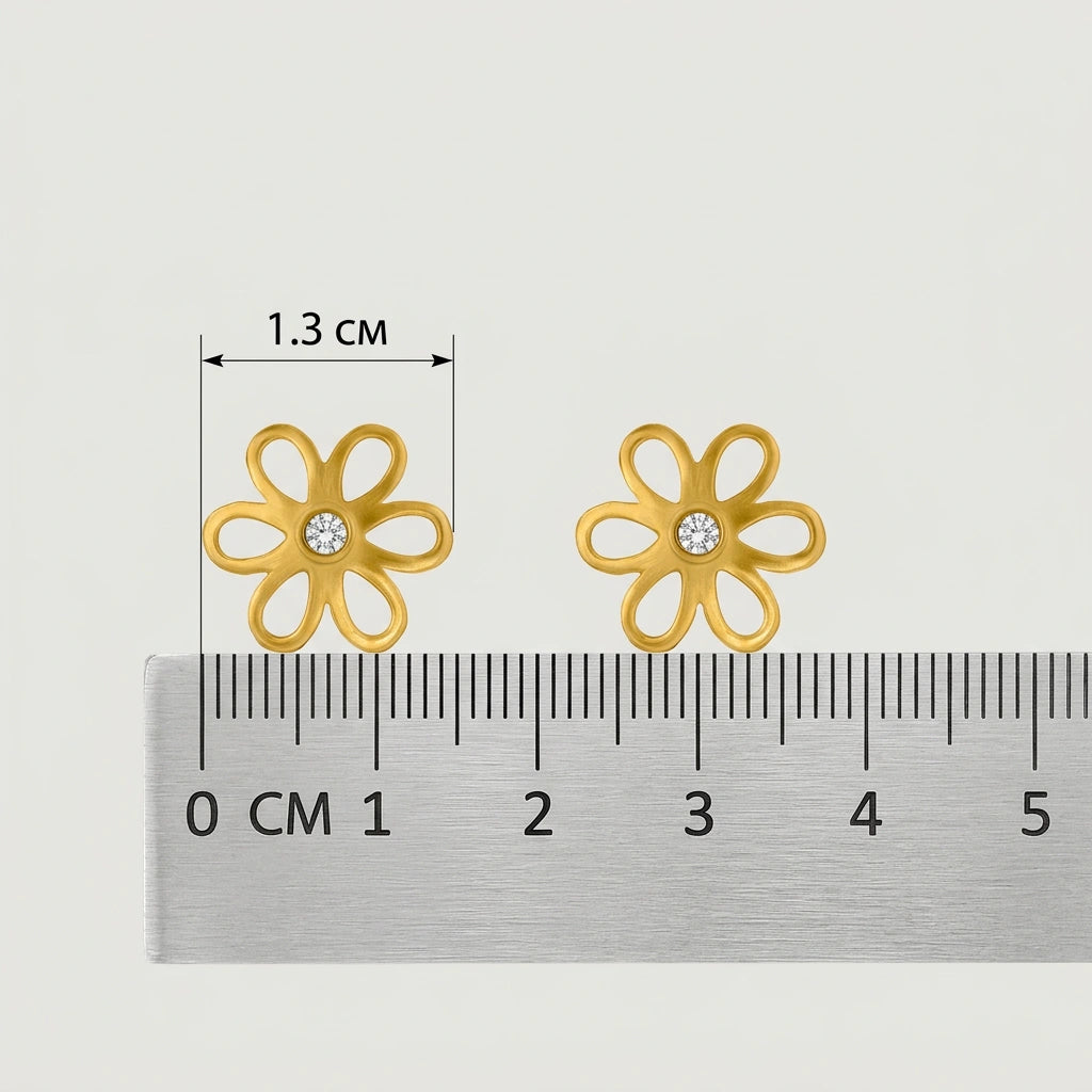 18k gold plated flower-shaped earrings with a ruler for scale on a white background
